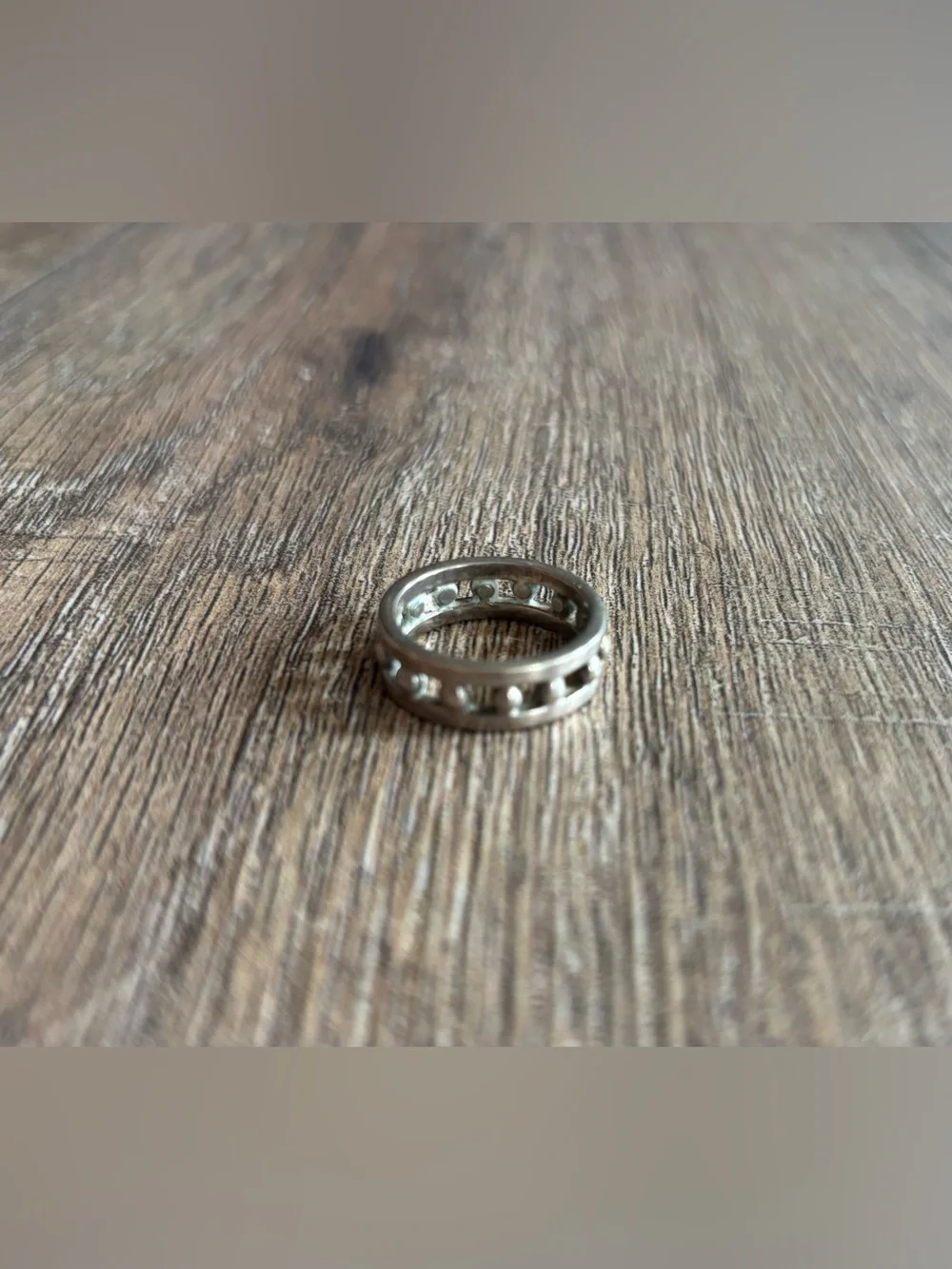Women’s size 11.5 silver-toned metal ball bearing or studded channel band ring
